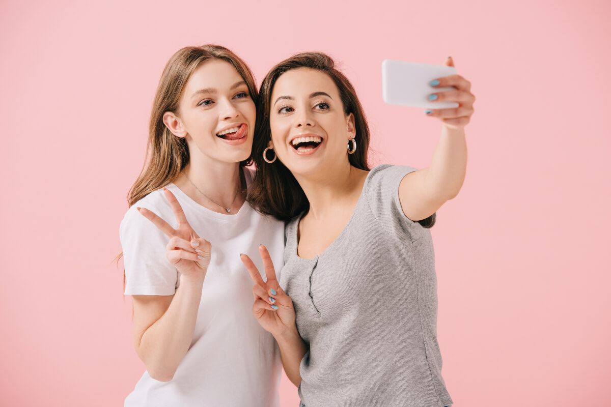 Women Taking Selfies on Smart Phone