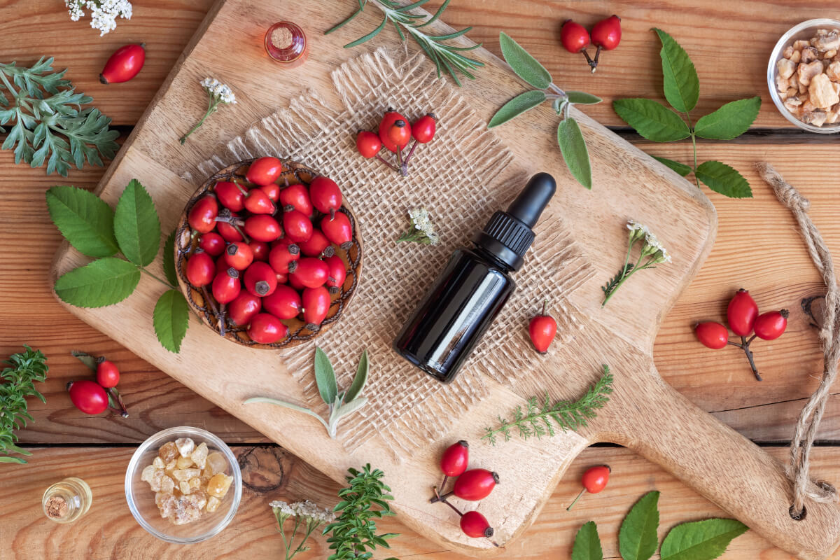 Rosehips and Rosehip Oil on Table