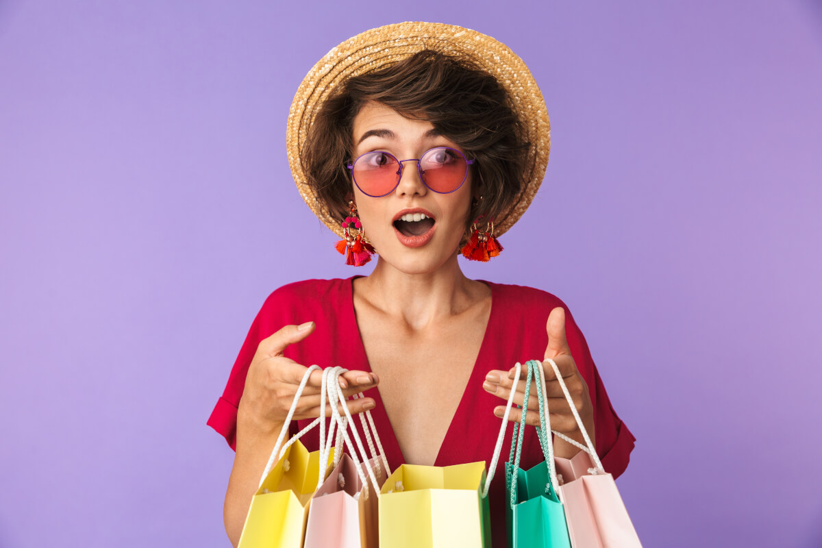 Woman Stocking Up with Shopping Bags